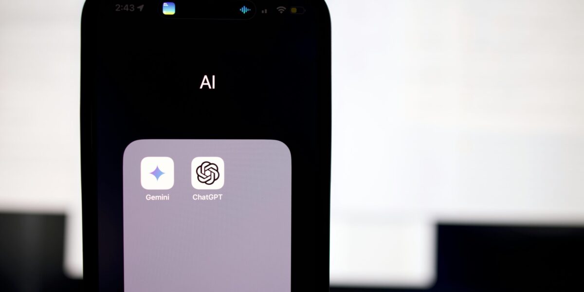 a close up of a cell phone with an ai button