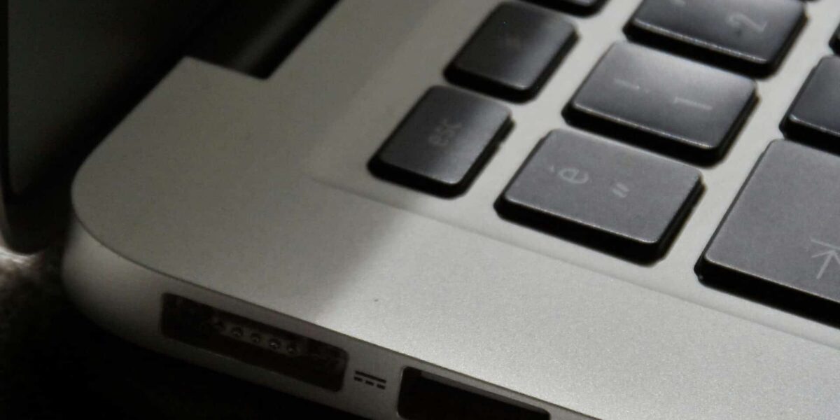 Free Detailed view of a silver laptop showing keyboard and multiple ports. Stock Photo